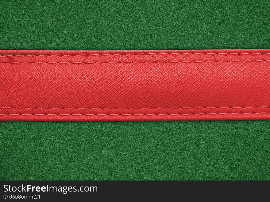 Red label on green grass background, leather label on green background. Red label on green grass background, leather label on green background