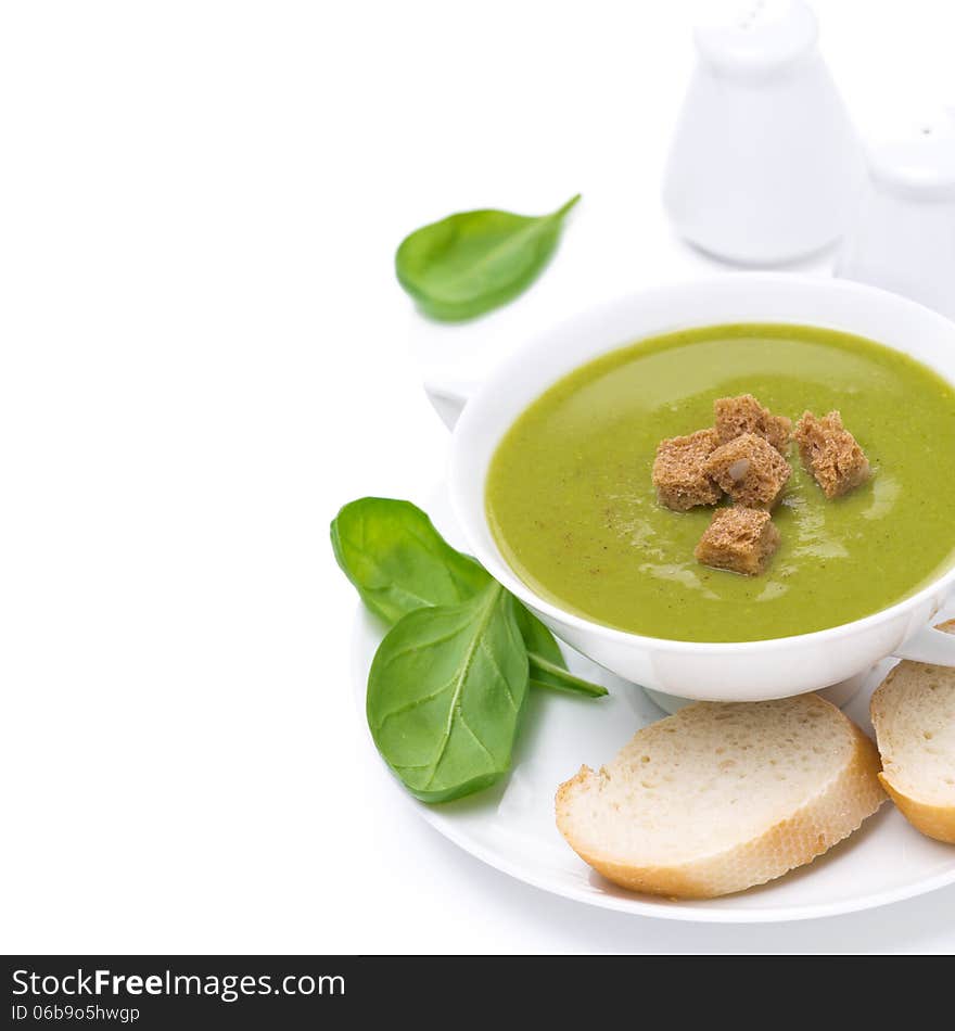 Delicious spinach soup with croutons, close-up, isolated