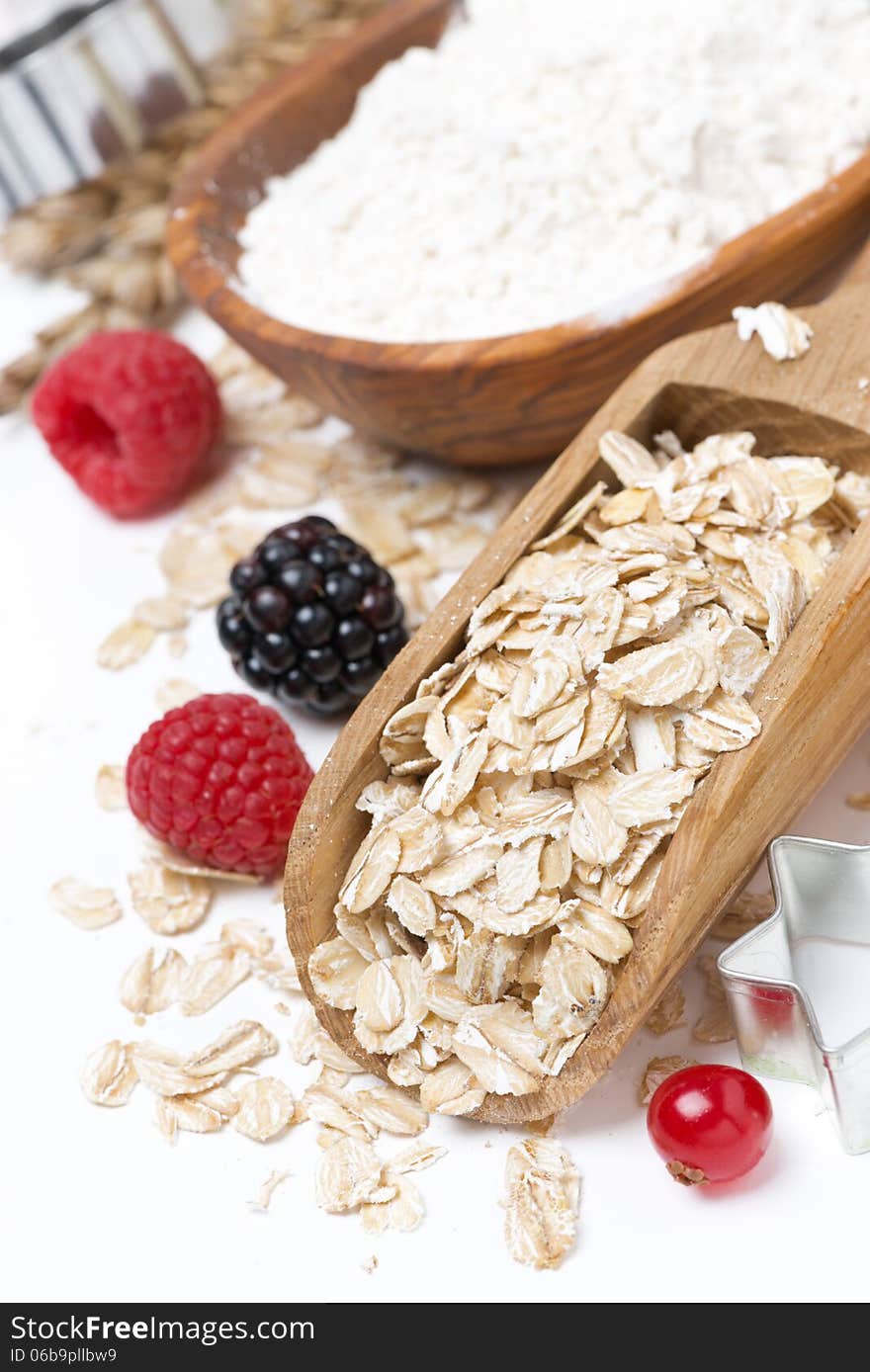 Oatmeal, flour, eggs and berries - ingredients for baking