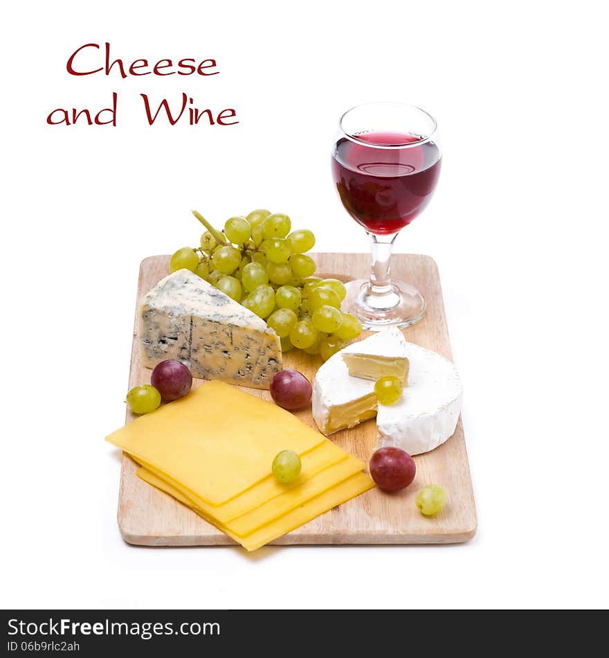 Three kinds of cheese, grapes and wine, isolated on white