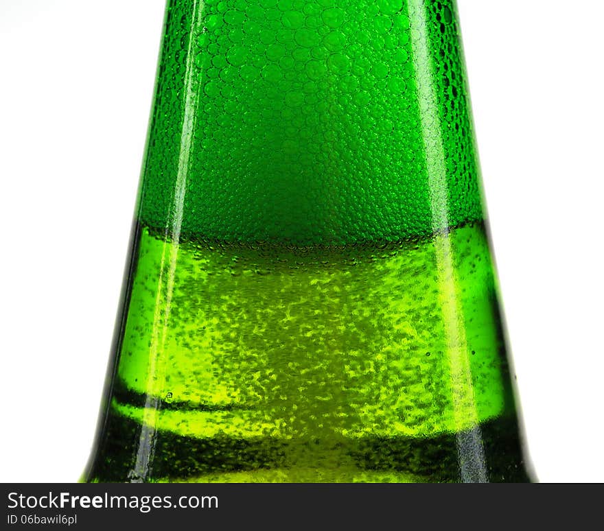 Green bottle of beer and gas bubbles