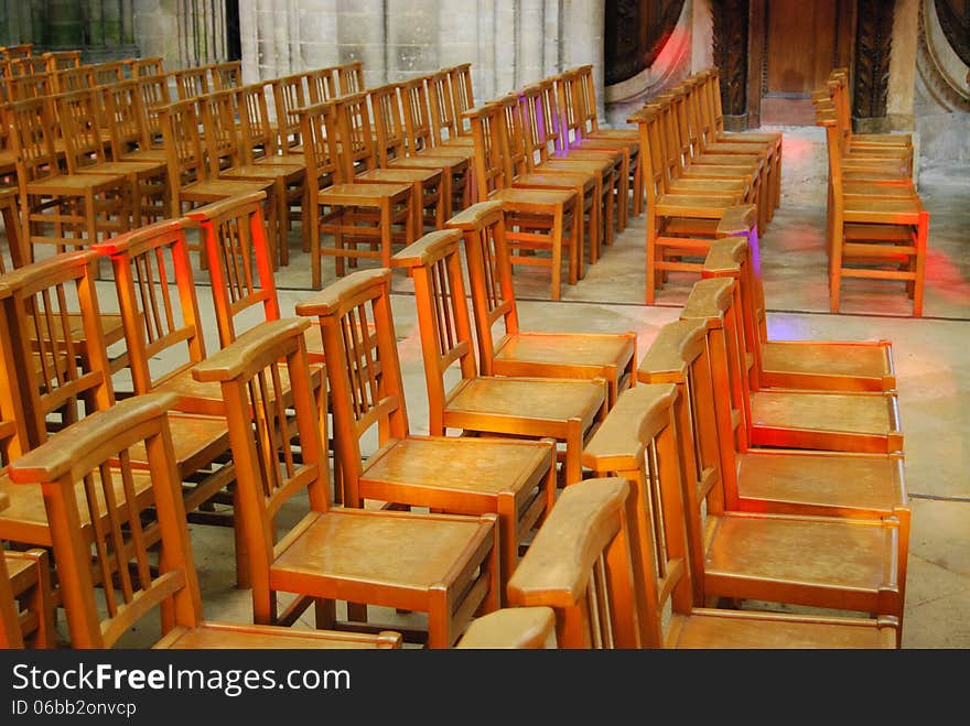 Bayeux Cathedral, Normandy, France. Chairs lit through stained glass window. Bayeux Cathedral, Normandy, France. Chairs lit through stained glass window.