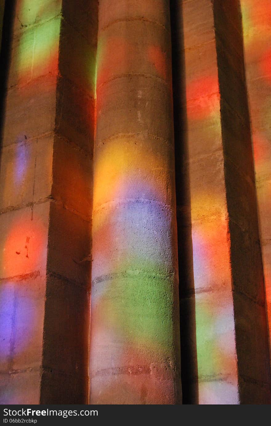 Bayeux Cathedral pillar lit through stained glass window, Normandy, France. Bayeux Cathedral pillar lit through stained glass window, Normandy, France