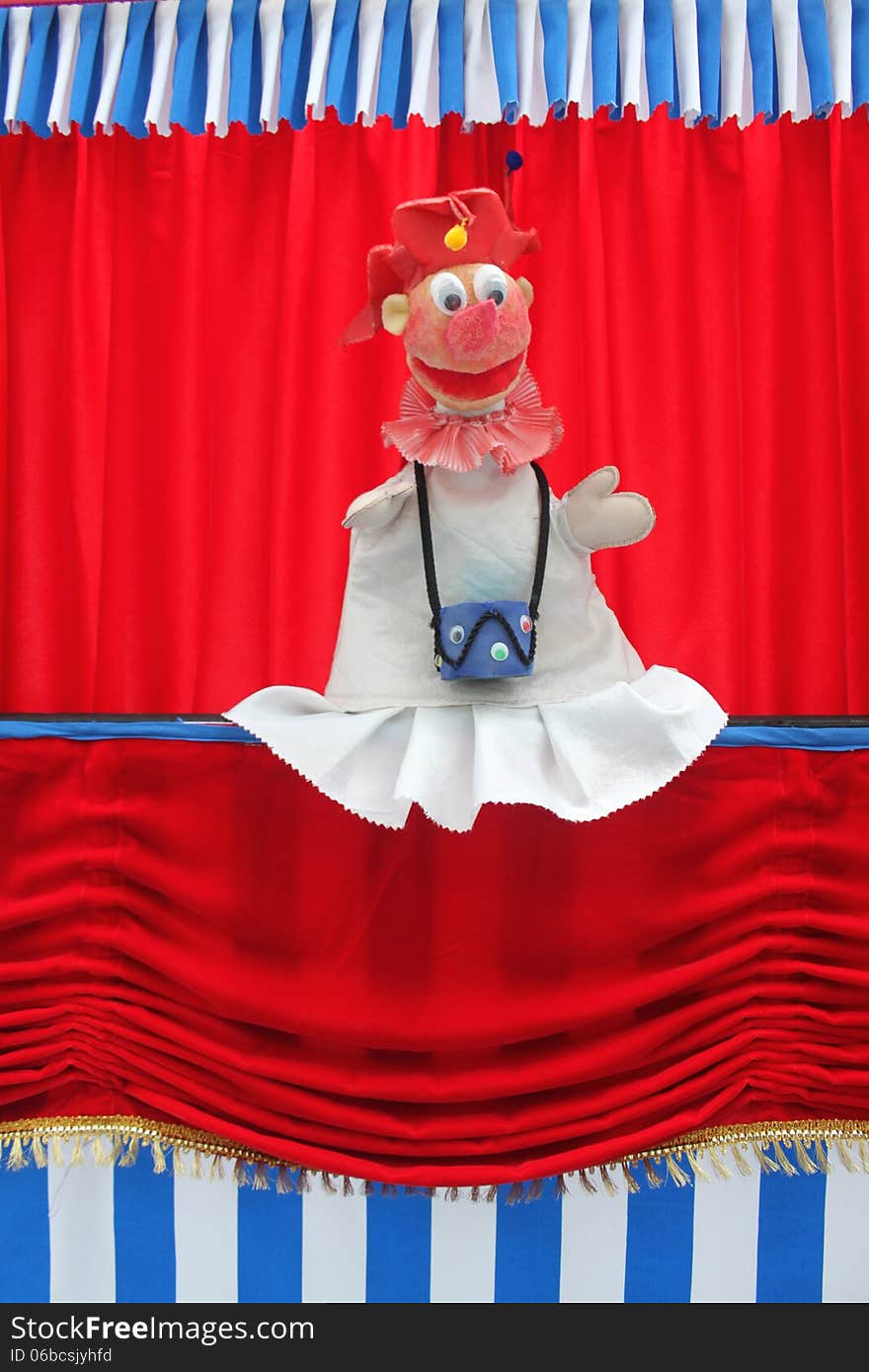 Clown doll on stage at puppet theater for children. Clown doll on stage at puppet theater for children.