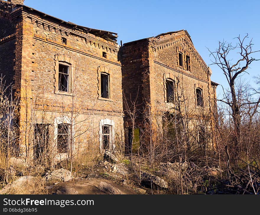 Old abandoned brick apartment building built in the early XX century. Old abandoned brick apartment building built in the early XX century.