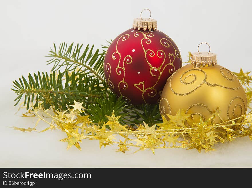 Red and Golden Christmas Balls on the white background.