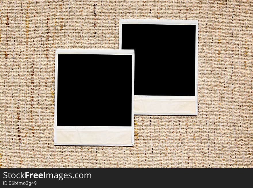 Old empty photo frames on linen texture