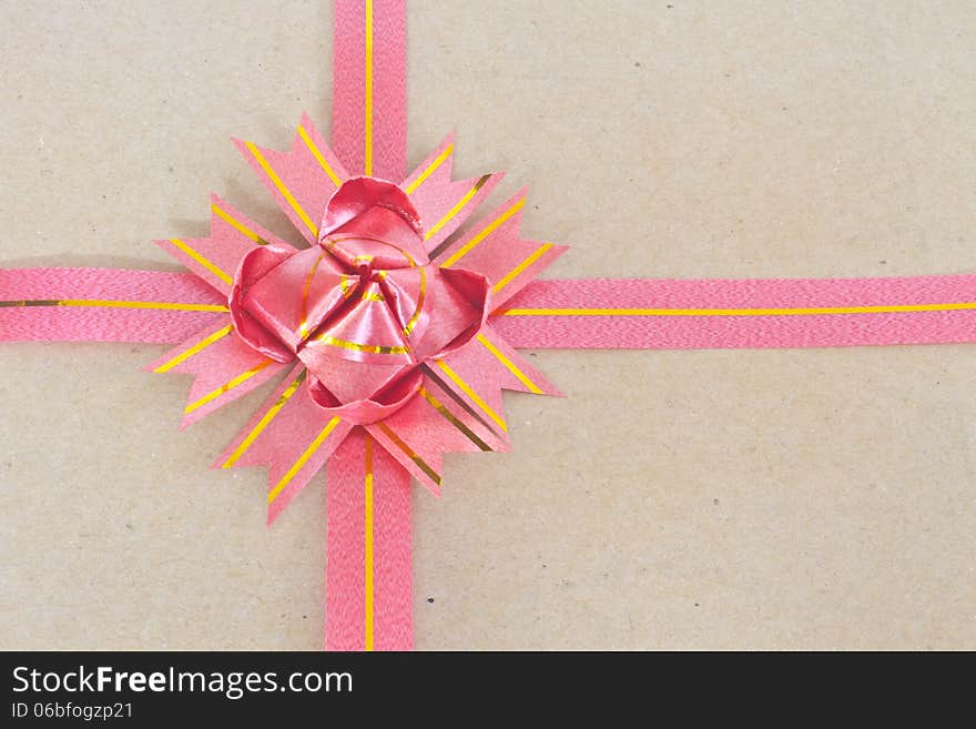 Ribbon and bow on brown gift box