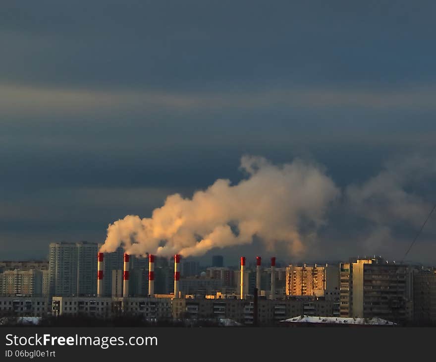 Thermal power plant steam amidst apartments in Moscow, Russia