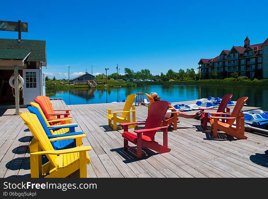 Chairs on a wooden deck near the boat station opposite the hotel. Chairs on a wooden deck near the boat station opposite the hotel