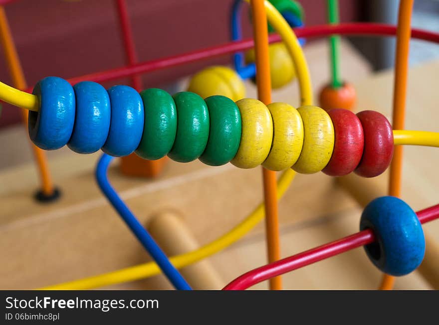 Wooden toy of colorful rings, close up.