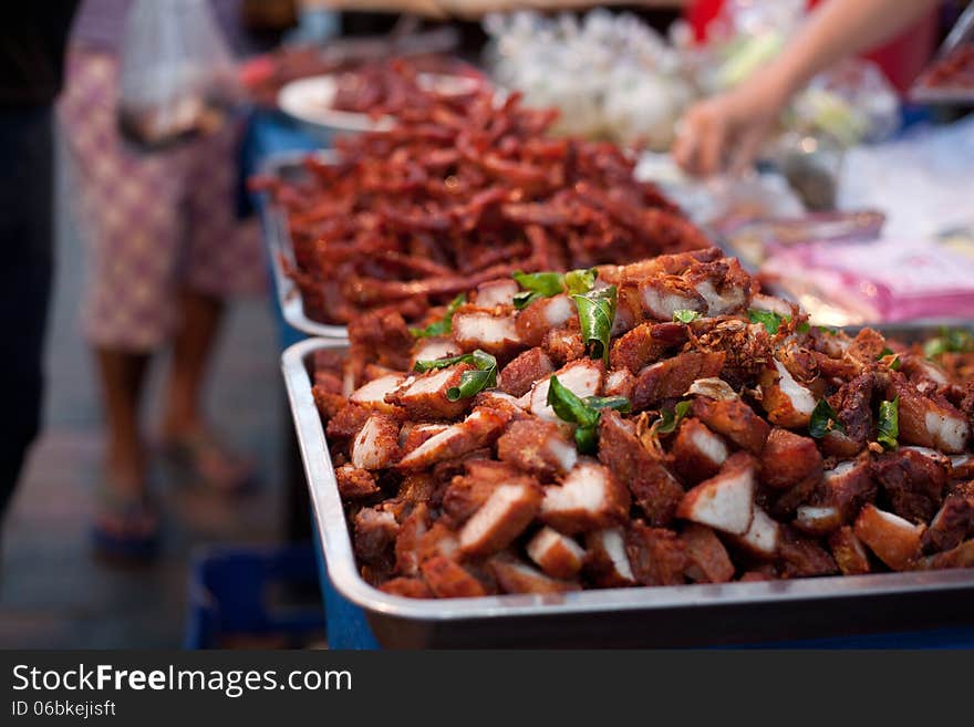 Pieces of grilled meat for sale on food street market. Pieces of grilled meat for sale on food street market