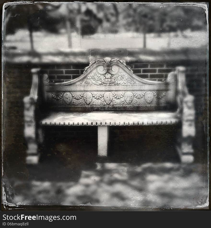 Ancient stone bench in park