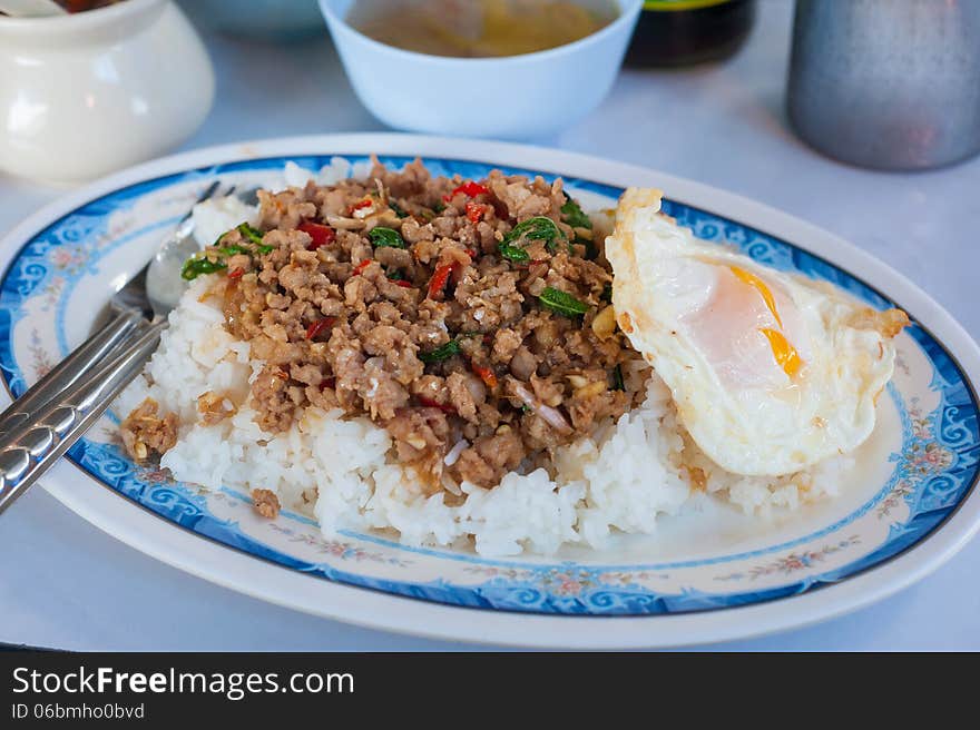 Rice with stir fried hot and spicy pork with basil