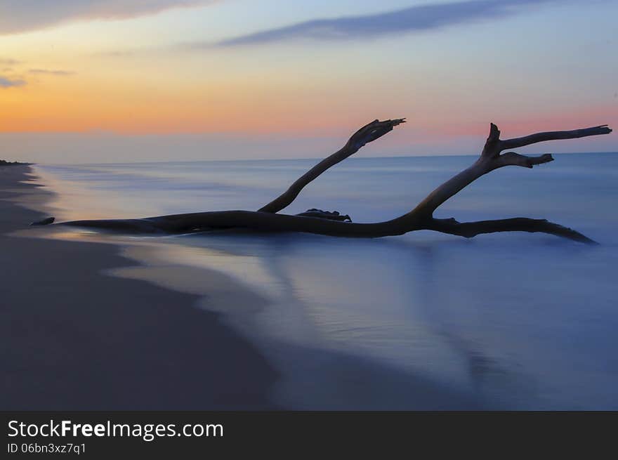 A sunset beach, nature and water