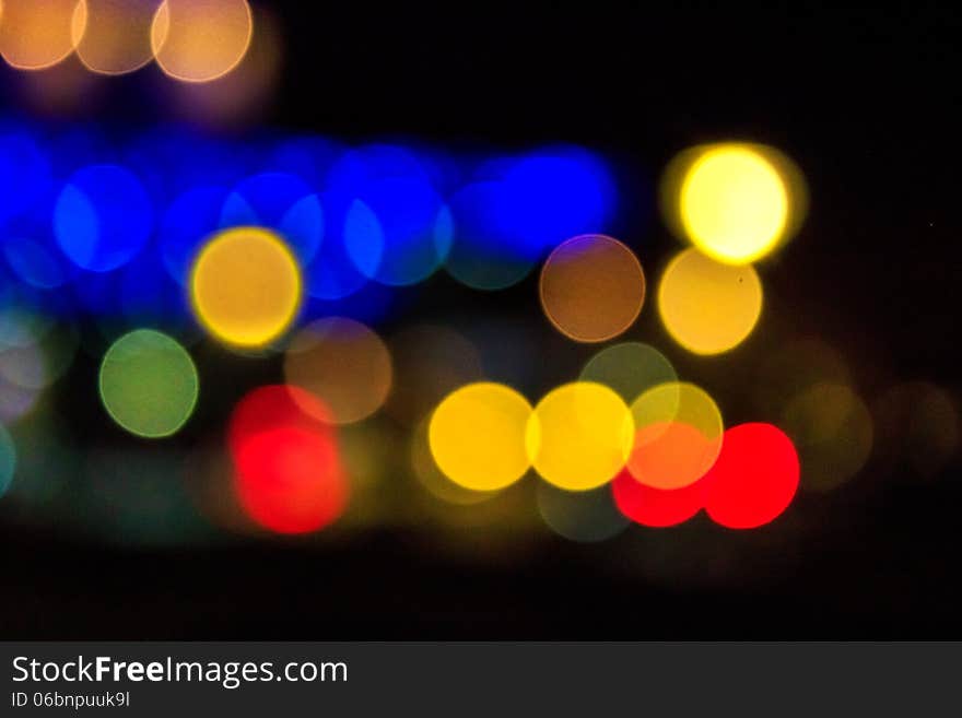 Abstract background of blurred warm lights with cool blue and purple background with bokeh effect. Abstract background of blurred warm lights with cool blue and purple background with bokeh effect