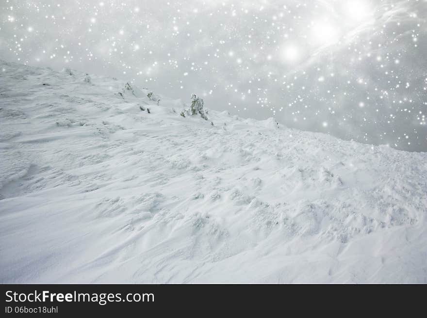 Christmas background with snow covered hillside