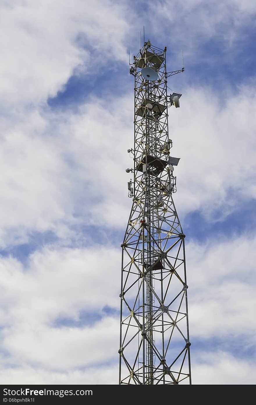 A high tower with various electronic equipments for communications. A high tower with various electronic equipments for communications