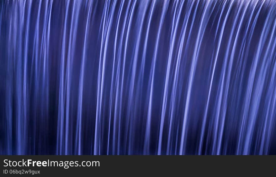 Waterfall flow and reflection creating a nice background. Waterfall flow and reflection creating a nice background