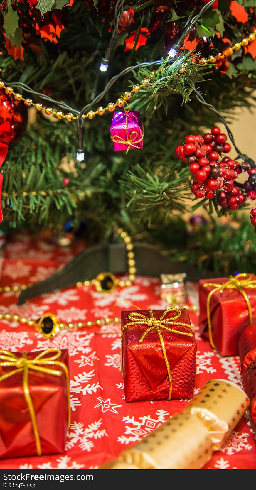 Various Christmas decor like gifts, crackers, ribbons