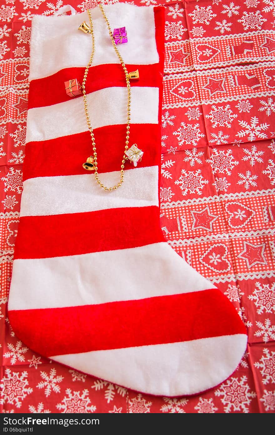 Christmas stocking with chain and gifts coming out