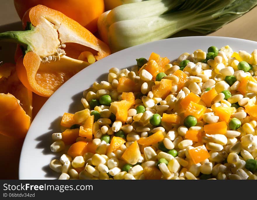 Fresh vegetables for cooking, orange pepper, green bean, corn, pine nuts.