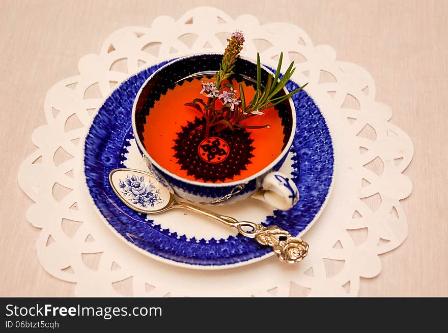 Herbal tea infusion in antique china teacup