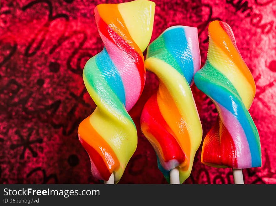 Christmas candy on a purple pink redish background