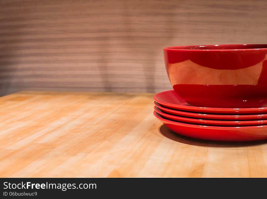 Reflective Ceramic Bowl on Wooden Kitchen Table. Reflective Ceramic Bowl on Wooden Kitchen Table