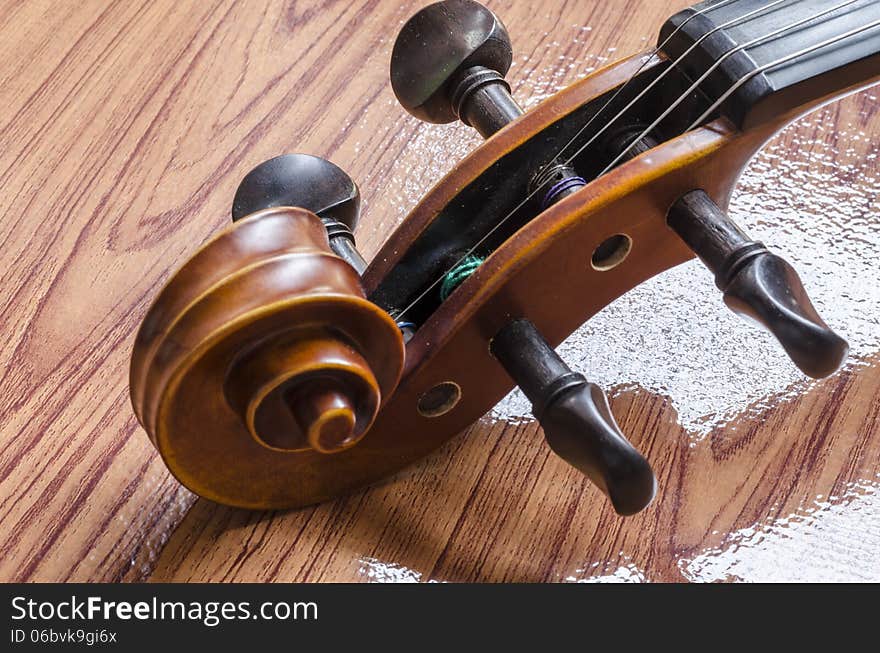 Violin on wood background