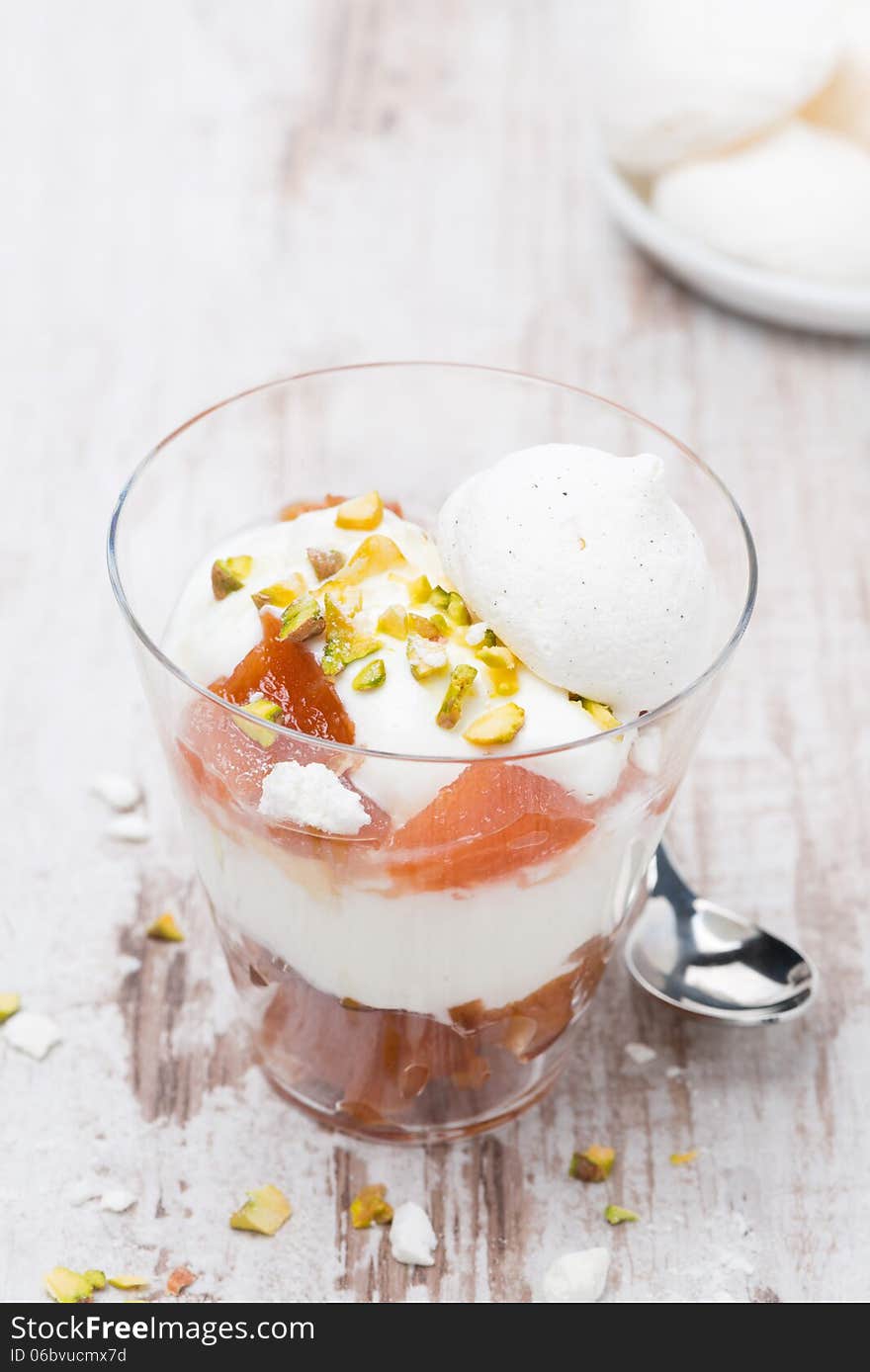 Dessert with peaches, whipped cream and meringue, top view