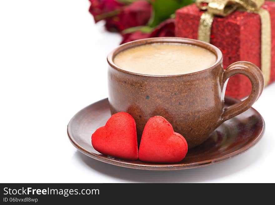 Cup of coffee, red candy, gift and roses for Valentine's Day, isolated on white. Cup of coffee, red candy, gift and roses for Valentine's Day, isolated on white