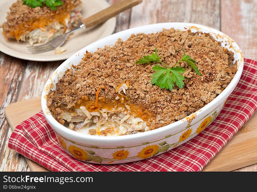 Gratin with fish and pumpkin, horizontal, close-up