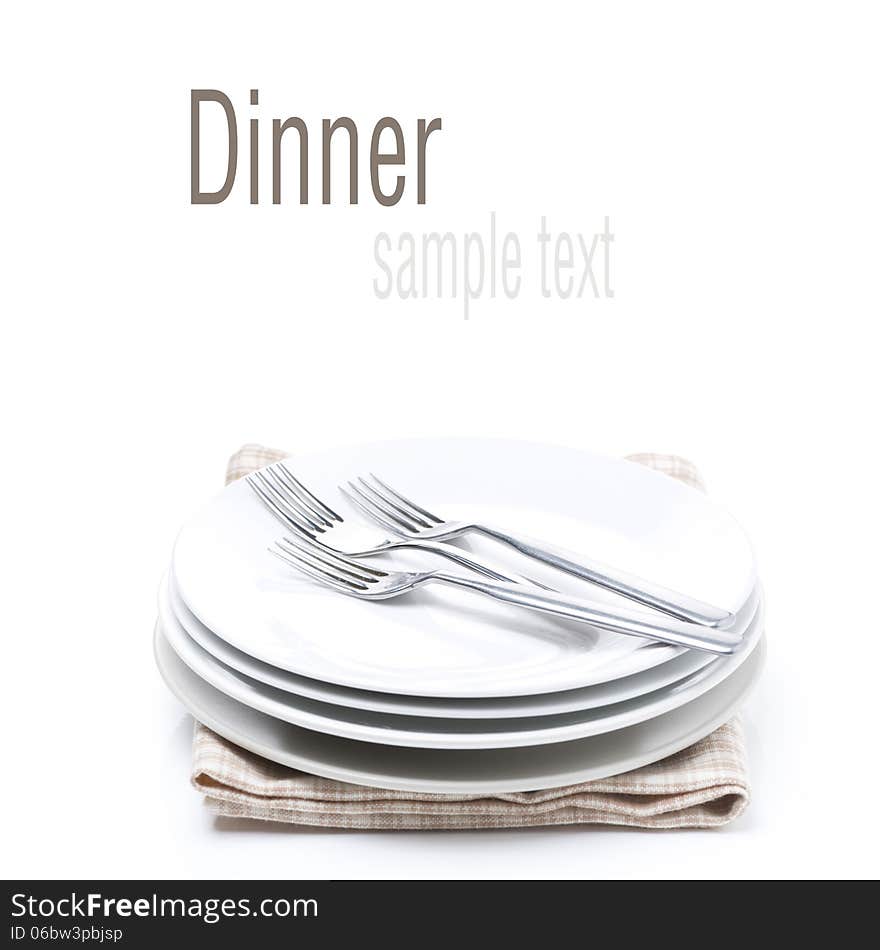 Tableware for dinner - plates and forks, isolated on white