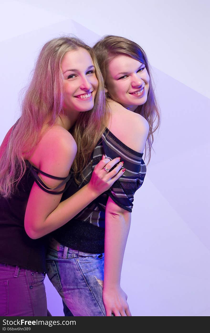 Portrait of two dancing girls on disco party