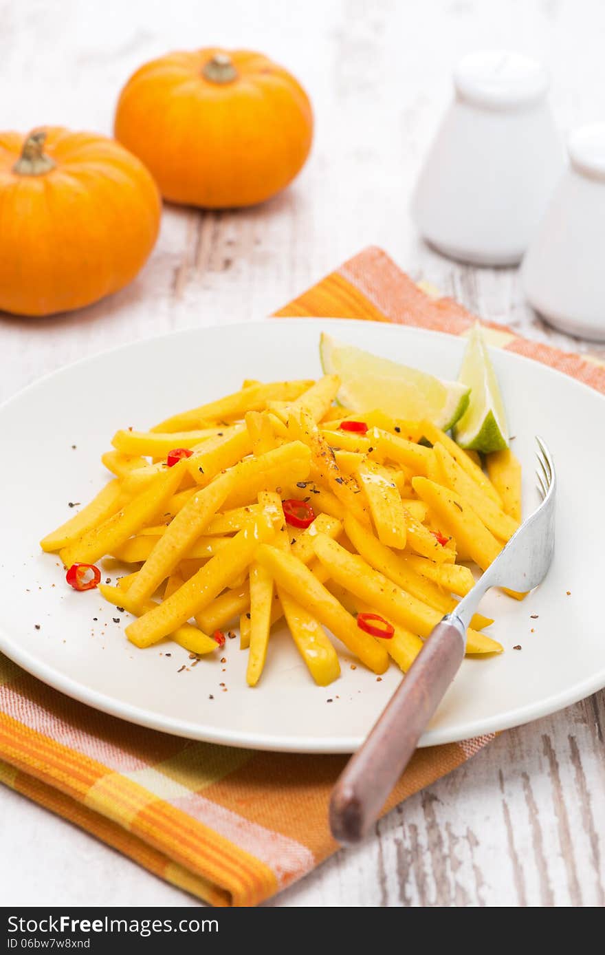 Roasted pumpkin with lime and chilli, vertical, close-up