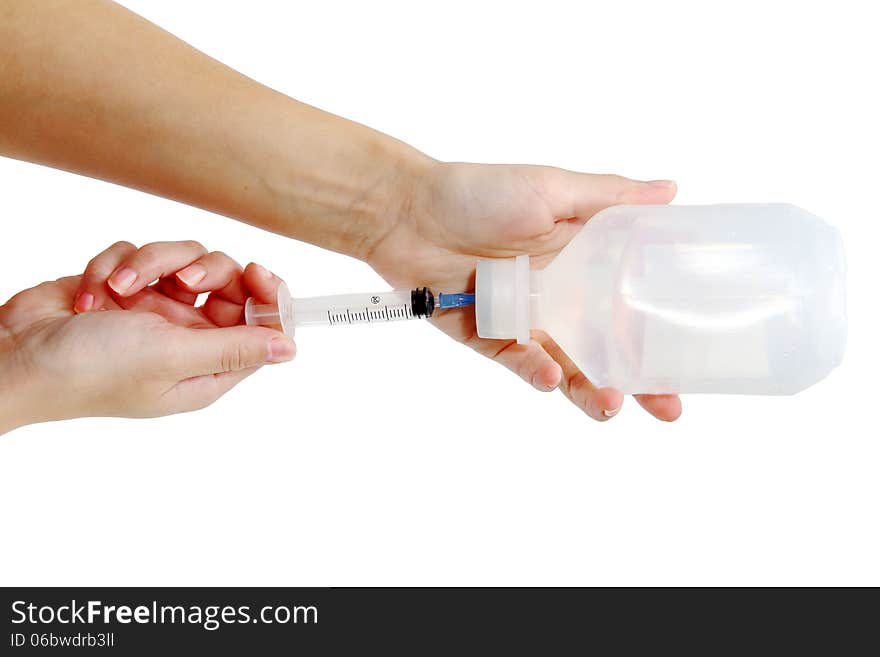 Syringe and Vial. Filling Syringe from Medicine Vial isolated on white background