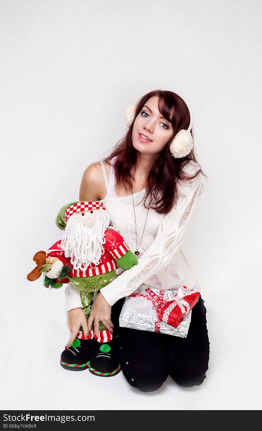 Happy girl with christmas present on white background