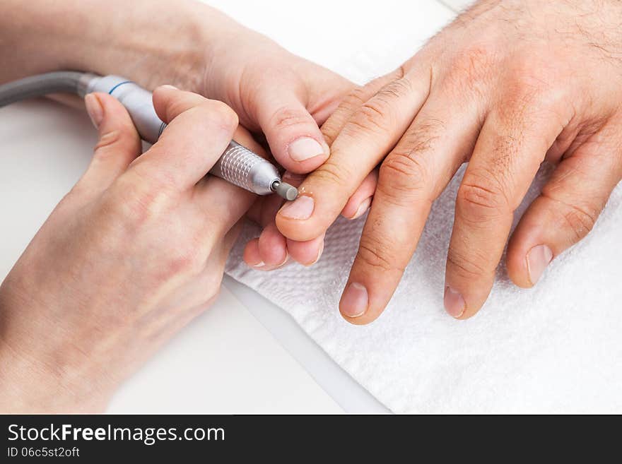 Manicure man close-up to the beauty salon