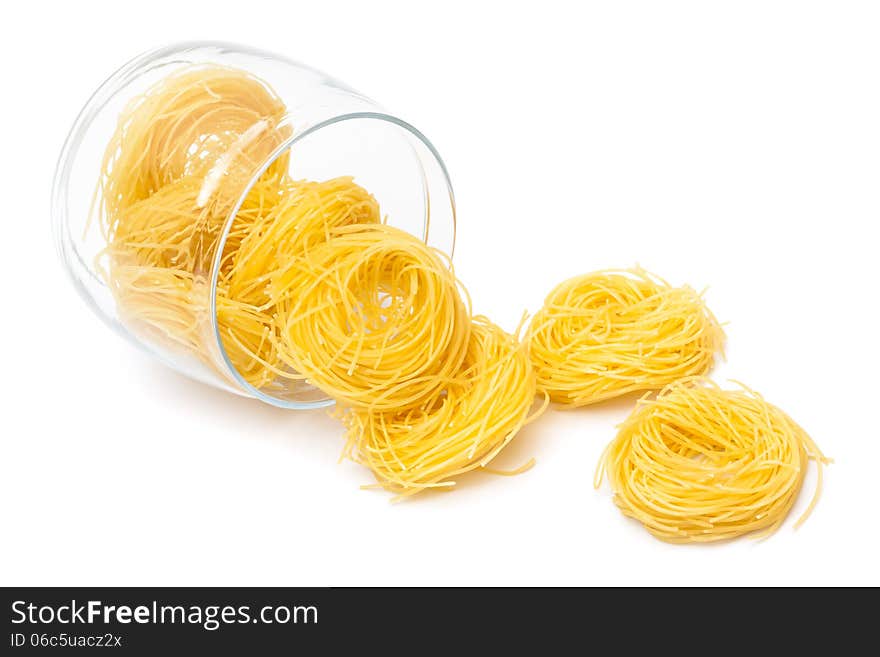 Pasta in glass jar on a white background