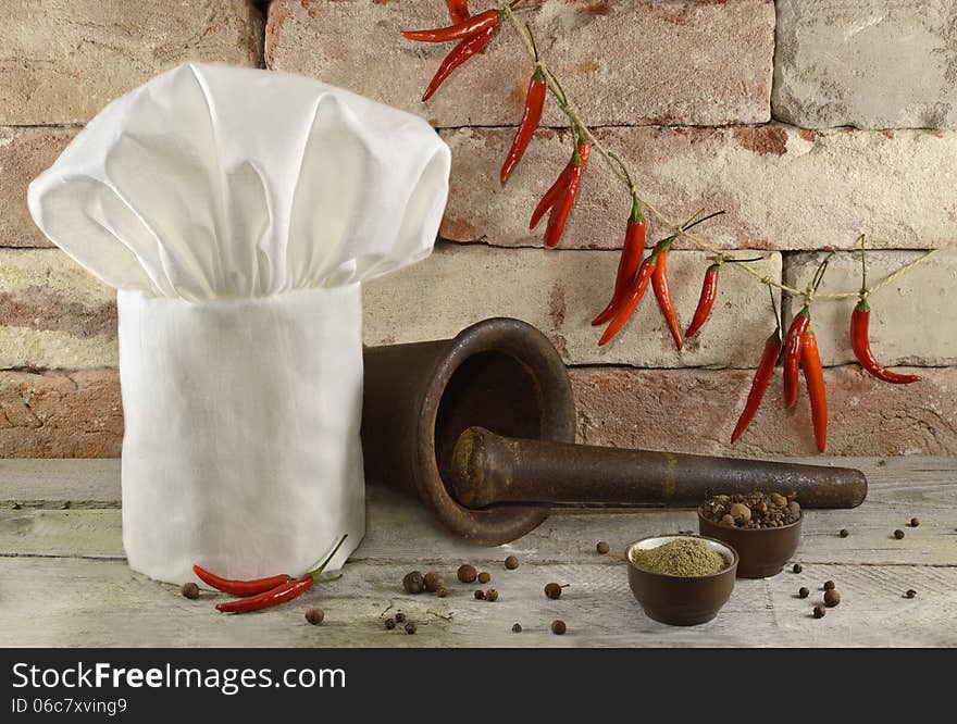 Toque With Kitchen Ware And Peppers