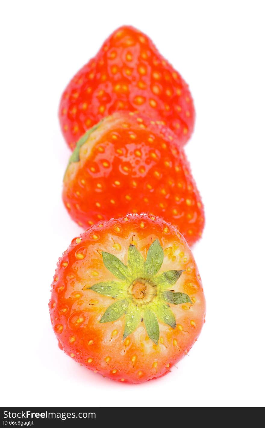 Three Fresh Ripe Strawberries In a Row isolated on white background. Three Fresh Ripe Strawberries In a Row isolated on white background