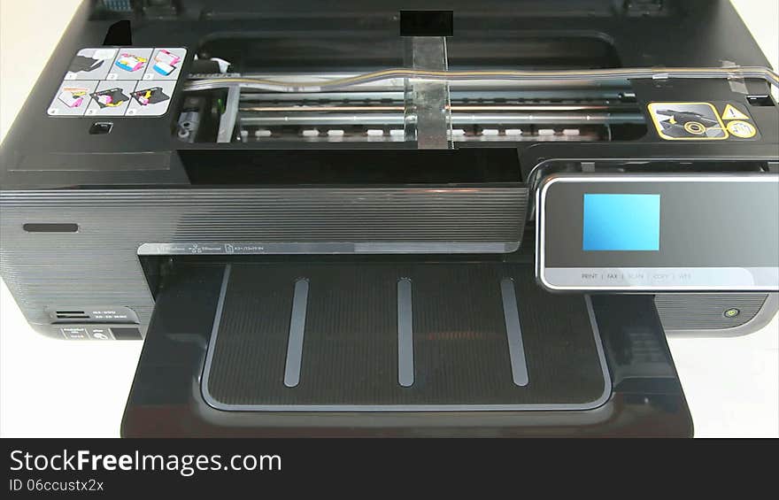 Inkjet printer working as proofed with printed CMYK color calibration target - HD Video. Inkjet printer working as proofed with printed CMYK color calibration target - HD Video