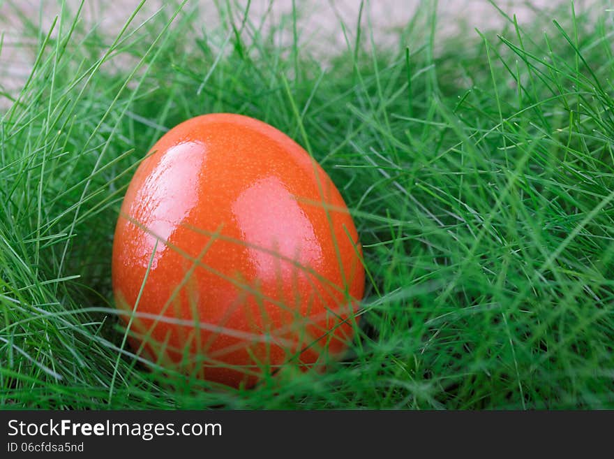 Orange Easter Egg On Green Grass