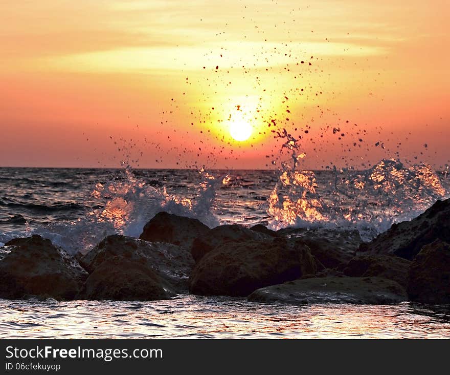 Breaking waves during a sunset at Kota Kinabalu