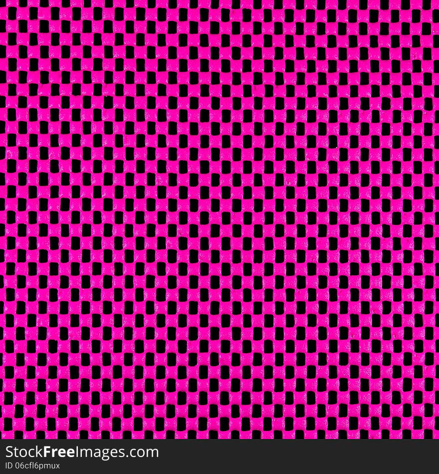 Pink rubber mesh on black background