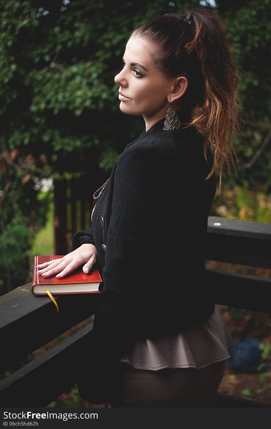 Portrait of beautiful brunette in a black coat. Portrait of beautiful brunette in a black coat