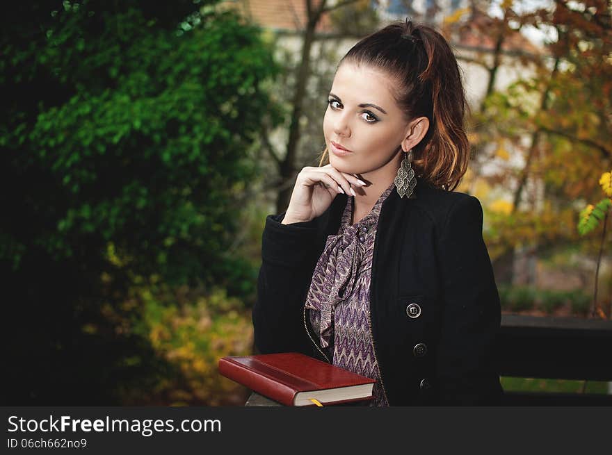 Beautiful brunette woman, female student fashion