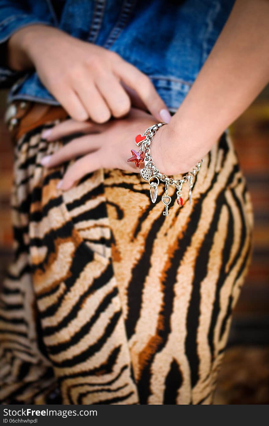 Young woman with silver jewelary on hand. Young woman with silver jewelary on hand