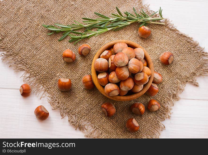 Hazelnuts, filbert on old wooden background closeup